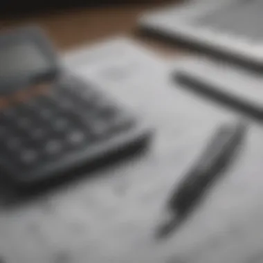 Financial Planning Tools A calculator and pen on a financial plan sheet